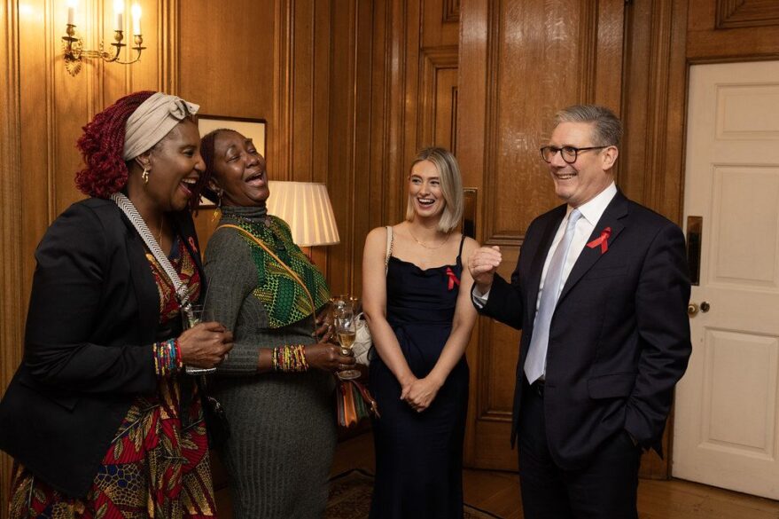 Prime Minister Kier Starmer hosting a World Aids Day reception standing with three women.